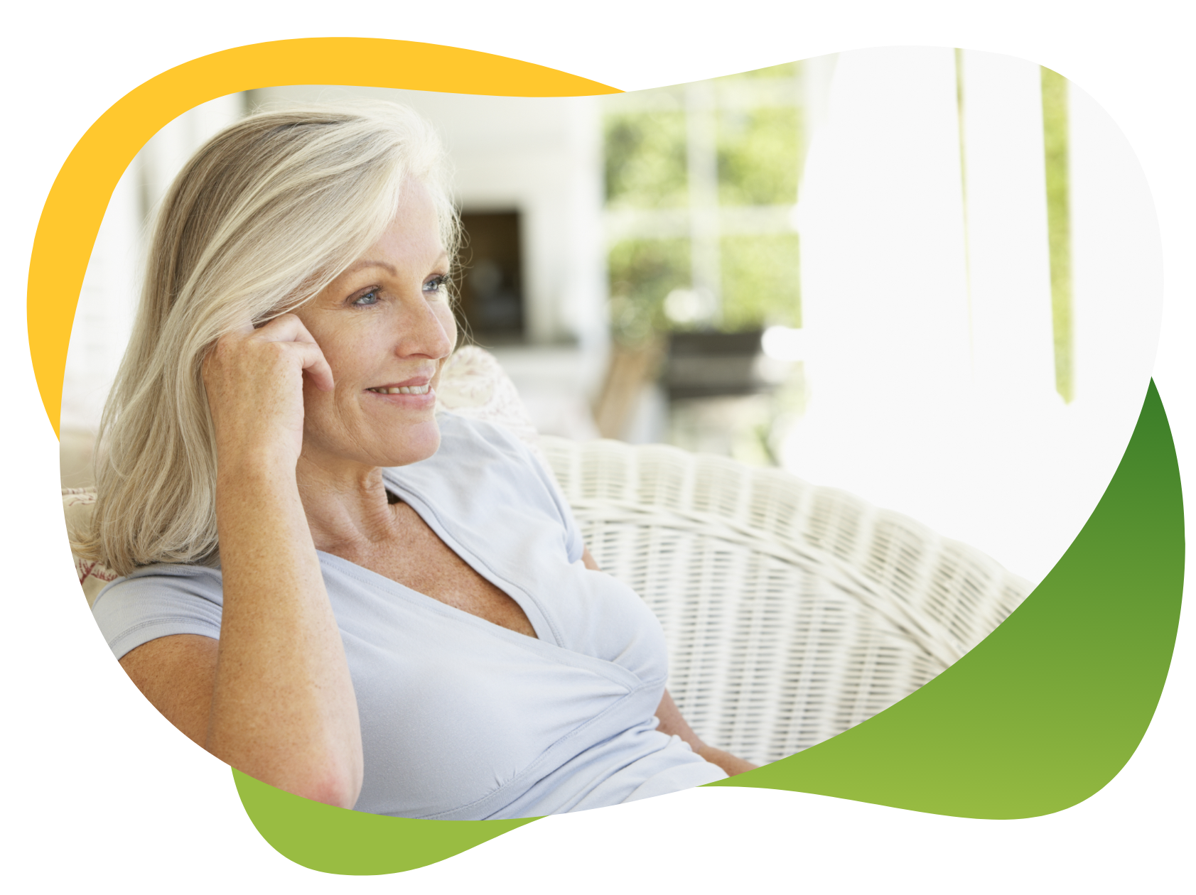 A relaxed middle-aged woman sitting on an armchair in her neat living room and talking on the phone